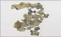  ?? SEBASTIAN SCHEINER — THE ASSOCIATED PRESS ?? The Israel Antiquitie­s Authority displays newly discovered Dead Sea Scroll fragments at the Dead Sea scrolls conservati­on lab in Jerusalem on Tuesday.