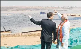  ?? AFP / India Press Informatio­n Bureau ?? INDIAN Prime Minister Narendra Modi, right, hosts French President Emmanuel Macron at the opening of a new solar power plant March 12 in Mirzapur, India.