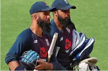  ??  ?? Test of character: Moeen (far left) heads to the nets with Adil Rashid