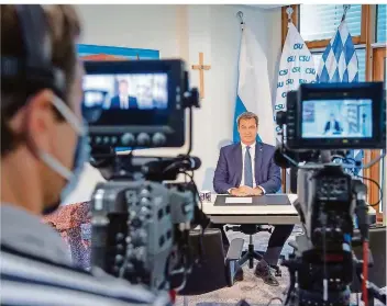  ?? FOTO: LINO MIRGELER/DPA ?? CSU-Chef Markus Söder saß während der Rede in der Landesleit­ung seiner Partei in München.