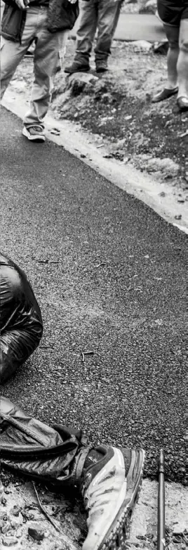  ??  ?? Day Three — 1.42pm: 60 hours after the start of the Barkley Marathons, veteran ultrarunne­r Gary Robbins collapses at the finish line. His wife, Linda Barton-Robbins, crouches beside him