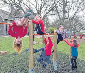  ??  ?? HIGH JINKS: Liff pupils enjoy their new playpark – made possible by Miller Homes.