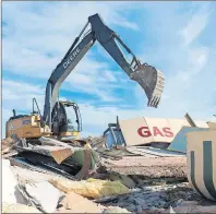  ?? CP PHOTO ?? An excavator demolishes The Ruby Cafe and the gas station, both sets of the “Corner Gas” TV show in Rouleau, Sask., in 2016. The gas station and the cafe are at the epicentre of the fictional town of Dog River, featured in “Corner Gas,” the popular TV...