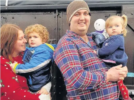  ??  ?? > Leo and Kim with family at the Brecon Mountain Railway earlier this year