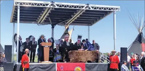  ?? Facebook image ?? The agreement is signed at Blackfoot Crossing Historical Park at Siksika June 2.