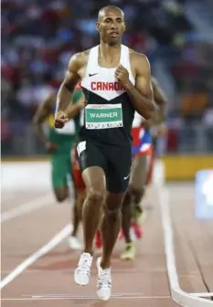  ?? LUCAS OLENIUK/TORONTO STAR ?? Canada’s Damian Warner leads the pack across the decathalon 1500m finish line Thursday, winning the race and the decathlon gold medal.