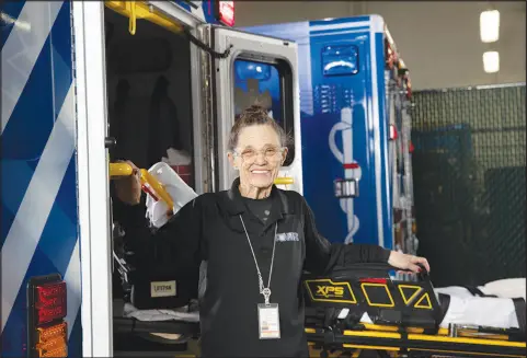  ?? PHOTOS BY STEVE MARCUS ?? Linda Netski, AMR (American Medical Response) manager of administra­tive services, poses Wednesday in the company’s ambulance bay in Las Vegas. Netski started as a nurse at AMR, then called Mercy Ambulance, in 1975. She’s retiring after a 50-year career in which co-workers say she’s seen it all.