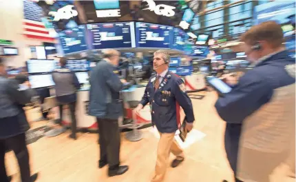  ??  ?? The S&P 500 is up more than 15.7% so far this year and has posted 52 record highs. BRYAN R. SMITH, AFP/GETTY IMAGES