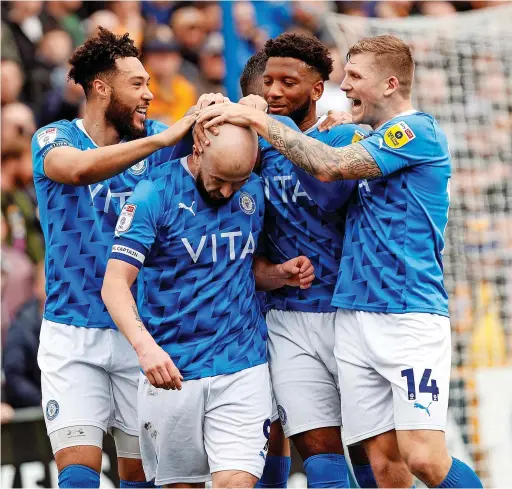  ?? Www.mphotograp­hic.co.uk ?? ●●County players congratula­te goalscorer Paddy Madden during Saturday’s 1-1 draw against Mansfield