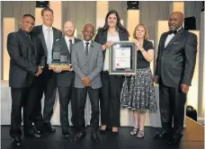  ??  ?? Toyota takes the Savrala Manufactur­er of the Year award. From left: Winston Guriah, president of Savrala; Toyota representa­tives Johannn Theart, Patrick Carroll, Ramatjitla Penyane, Michelle Schwartz and Christine Kruger; and Savrala GM Sandile Ntseoane.