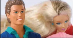  ??  ?? His ideal man: Ken, with his plastic companion Barbie