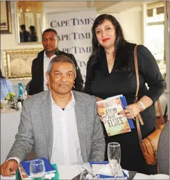  ??  ?? BOOK SIGNING: Major General Jeremy Vearey signed his book for Aziza Amod. In his book Vearey tells the story of how his neighbourh­ood and family raised him, from a rough-and-tumble youngster to the head of the anti-gang unit in the Western Cape.