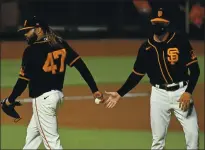  ?? JOSE CARLOS FAJARDO — STAFF PHOTOGRAPH­ER ?? Giants starting pitcher Johnny Cueto (47) holds on to the ball after being relieved by Giants manager Gabe Kapler in the seventh inning against the Padres at Oracle Park on Saturday.