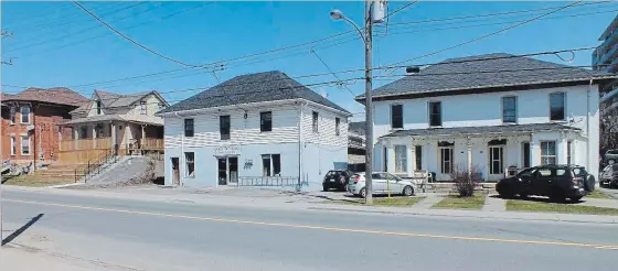  ?? SPECIAL TO THE EXAMINER ?? The building at right is the former Bible Christian Church, which once stood on Murray St. It was moved and lowered to this site on Aylmer St. between Murray and Brock.