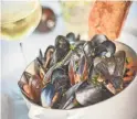  ?? J. MARTIN HARRIS PHOTOGRAPH­Y ?? Butter and chardonnay steamed mussels at Ocean 44 in Scottsdale.