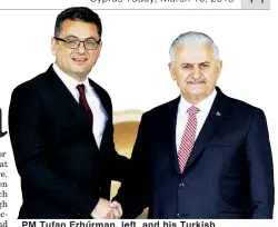  ??  ?? PM Tufan Erhürman, left, and his Turkish counterpar­t Binali Yıldırım