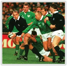  ??  ?? A LEVEL ABOVE: Gregor Townsend takes on the Irish defence in 1996