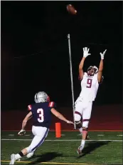  ?? Photo by Ernest A. Brown ?? Woonsocket junior wide receiver Xavier Alvarez (9) is in the air in the back of the end zone as Lincoln senior Allen Setarro (3) gives chase during the second quarter of Friday’s game. The pass fell incomplete.