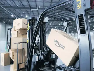  ?? GAVIN YOUNG ?? Amazon broke ground on a new 600,000-square-foot warehouse in Calgary last fall as demand grows for distributi­on centres to satisfy the boom in e-commerce. Some large cities are running out of industrial land.