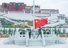  ?? (Reuters) ?? THE CHINESE FLAG is raised at Potala Palace in Lhasa in Tibet on July 1, during a ceremony marking the 96th anniversar­y of the founding of the Communist Party of China.