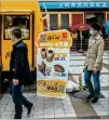  ?? GILLES SABRIE/NEW YORK TIMES ?? A Mcdonald’s ice cream truck outside a vaccinatio­n center in Beijing on Tuesday offers a twofor-one promotion for those getting a COVID-19 vaccine.
