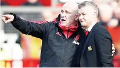  ??  ?? Solskjaer and assistant coach Mike Phelan during the match at Old Trafford in Manchester, Britain in this March 30 file photo. — Reuters photo