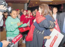  ??  ?? Supporters grabbed hugs and selfies with Ardern after her speech at the Labour Party rally in Wellington yesterday.