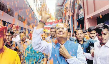  ?? PTI PHOTO ?? Shivraj Singh Chouhan has travelled throught out the state touching people’s feet, greeting them with folded hands, capitalisi­ng on his mama (uncle) image.