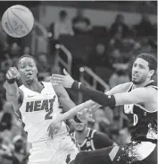  ?? TREVOR RUSZKOWSKI USA TODAY Sports ?? Terry Rozier, left, is defended Sunday by the Pacers’ Tyrese Haliburton. Rozier scored only four points.