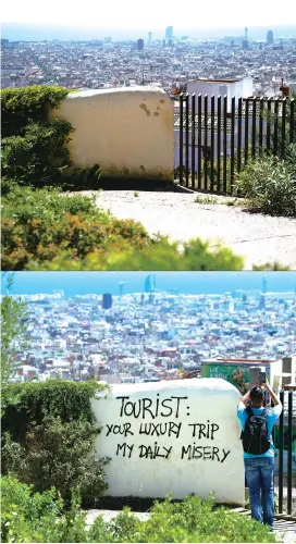  ??  ?? The top picture taken on May 20 shows Barcelona’s skyline seen from Park Guell during the national lockdown to prevent the spread of the COVID-19 disease. The photo below was taken on August 10, 2017 at the exact same spot where a tourist takes a picture next to a wall with graffiti reading ‘Tourist: your luxury trip — my daily misery.’ — AFP