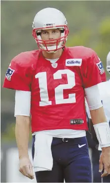  ?? AP PHOTO ?? EYE OF THE TIGER: Patriots quarterbac­k Tom Brady looks on during the joint practice with the Houston Texans yesterday in White Sulphur Springs, W.Va.