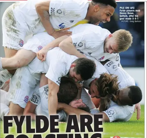  ?? PICTURE: Greig Bertram ?? PILE ON! AFC Fylde players mob Danny Rowe, bottom, after his goal made it 4-1