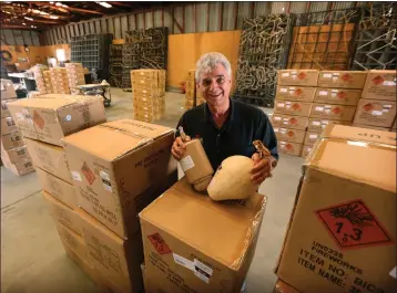  ?? SNCG FILE PHOTO ?? Jim Souza with large shells used in fireworks shows. “The sky is our canvas — and fireworks are our paint,” he says.