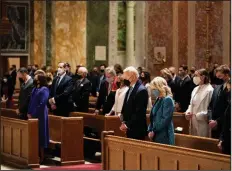  ?? (The New York Times/Doug Mills) ?? President-elect Joe Biden and his wife Dr. Jill Biden attend Mass at the Cathedral of St. Matthew the Apostle, along with Vice President-elect Kamala Harris and her husband, Doug Emhoff, during Inaugurati­on Day ceremonies in Washington on Jan. 20.