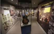  ??  ?? U.S. musician Jimi Hendrix’s Epiphone acoustic guitar is displayed in an exhibition space at the central London flat where he once lived. The museum has just opened.