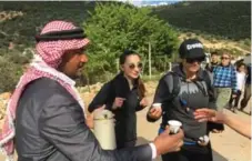  ?? ANDREW EVANS/TRIBUNE NEWS SERVICE ?? A Jordanian host welcomes hiker guests, who climb hundreds of zigzagging steps, with traditiona­l cups of Arabic coffee, spiced with cardamom.