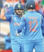  ??  ?? Indian captain Virat Kohli and Yuvraj Singh stiched a vital partnershi­p of 93 runs.