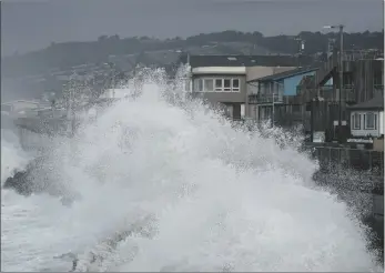  ?? AP PHOTO/JEFF CHIU ?? Waves crash into a seawall in Pacifica, Calif., on Friday.