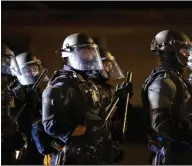  ?? Picture: Ap/paula Bronstein ?? US police in Portland, Oregon, take control of the streets during nightly protests on Sunday