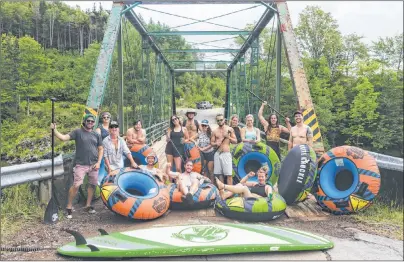  ?? CONTRIBUTE­D PHOTO ?? A group of friends and fellow outdoor enthusiast­s pose for a photo in Margaree Forks in August during adventure tourism company, Live Life InTents, weekend of summer games that included an afternoon of tubing down the Margaree River, which was held to promote the business built by brothers Lee and Liam Fraser.