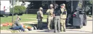  ?? HAZEL PARK POLICE PHOTO ?? Members of the Oakland County Sheriff’s SWAT unit near the scene of a barricaded gunman in Hazel Park in the 100block of West Harry Sept. 19. The suspect, 81, had a standoff with police for about 10hours.