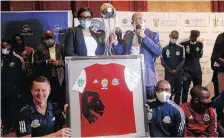  ??  ?? TTM players and members of the management and technical team with the Nedbank Cup Trophy in Polokwane yesterday.