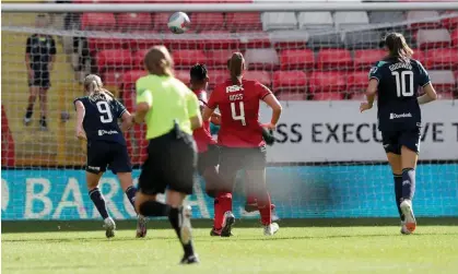  ?? Photograph: Henry Browne/The FA/Getty ?? Bex Rayner of Sheffield United Women (left) watches her shot swerve into the net and earn a point at Charlton Women on the opening weekend.
