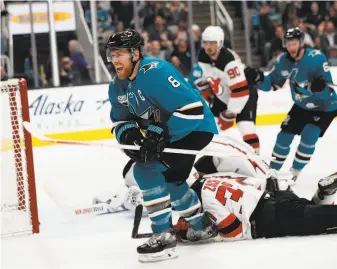  ?? Josie Lepe / Associated Press ?? Joe Pavelski celebrates after scoring at SAP Center in the first period of the Sharks’ victory, their fourth in their past five games. He also had an assist against the Devils.