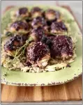  ?? PHOTO BY CATHY THOMAS ?? Bone-in chicken thighs are a relative deal at the supermarke­t and a raspberry balsamic topping brings them to life atop a bed or orzo pasta.