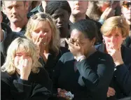  ?? JEROME DELAY/POOL PHOTO VIA AP, FILE ?? FILE - Spectators weep in the crowd along London’s Whitehall Saturday Sept. 6, 1997, during the funeral ceremony for Diana, Princess of Wales. It was a warm Saturday evening and journalist­s had gathered at a Paris restaurant to enjoy the last weekend of summer. At sometime past midnight, phones around the table began to ring all at once. News desks were contacting reporters and photograph­ers to alert them that Princess Diana’s car had crashed in the Pont de l’alma tunnel in Paris. That’s how the news unfolded in the early hours of Aug. 31, 1997.