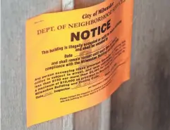  ?? MILWAUKEE JOURNAL SENTINEL ?? An eviction notice is posted on a trailer on Milwaukee’s south side. Several authors explore the effects of eviction on urban poverty problems.