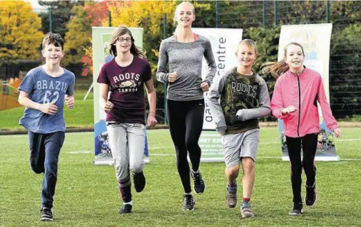  ?? Photograph: Kevin Emslie ?? THROUGH THEIR PACES: From left, youngsters Rohan Gauld, Lucy Drysdale, Fraser Drysdale and Pippa Hall with world championsh­ip 1,500m silver medallist Hannah England launching Run Garioch 2017 at Garioch Sports Centre, Inverurie.