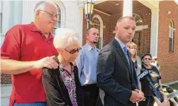  ?? Hearst Connecticu­t Media file photo ?? Milford State's Attorney Kevin Lawlor stands outside court with Merry Jackson, left, and her husband, Douglas Jackson, far left, moments after Scott Gellatly pleaded guilty to killing Lori Jackson, his estranged wife and attempting to kill Merry in Oxford on May 7, 2014.