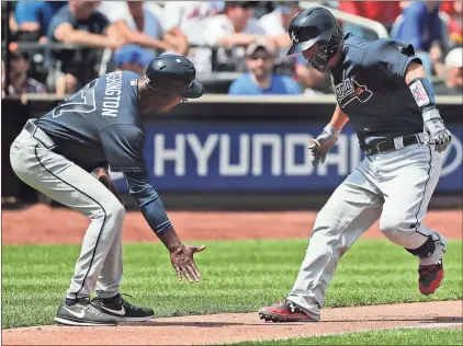  ?? Julie Jacobson / AP ?? Atlanta’s Kurt Suzuki (right) celebrates with third base coach Ron Washington after hitting a two-run homer against the New York Mets.